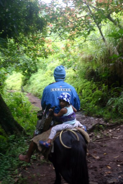 Local boy and father easily make their way on horseback over this trail